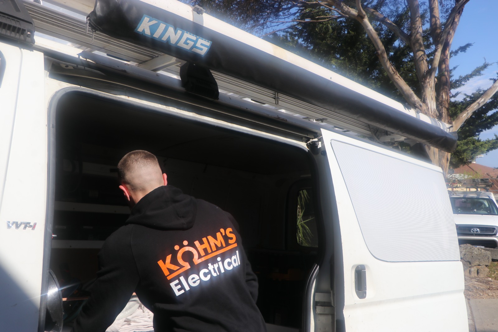 Kohm's Electrical service van and uniform